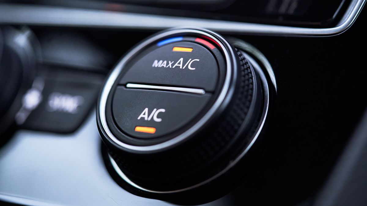 Car air conditioning system with black knob and Max A/C text on top half of knob, and A/C text on bottom half of knob.