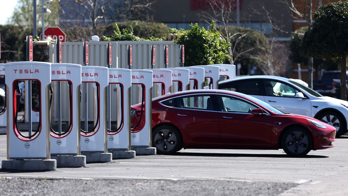 A Tesla car recharges its battery at the Petaluma Supercharger on March 09, 2022 in Petaluma, California.