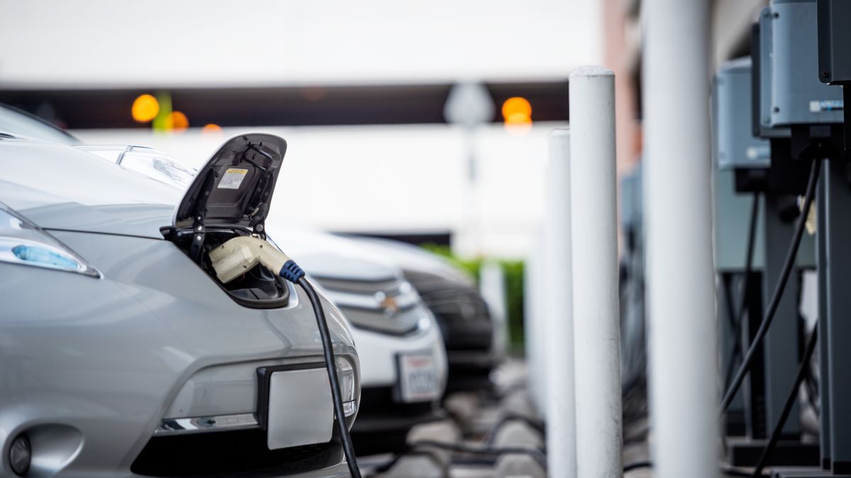 Electric vehicles at an EV charging station.